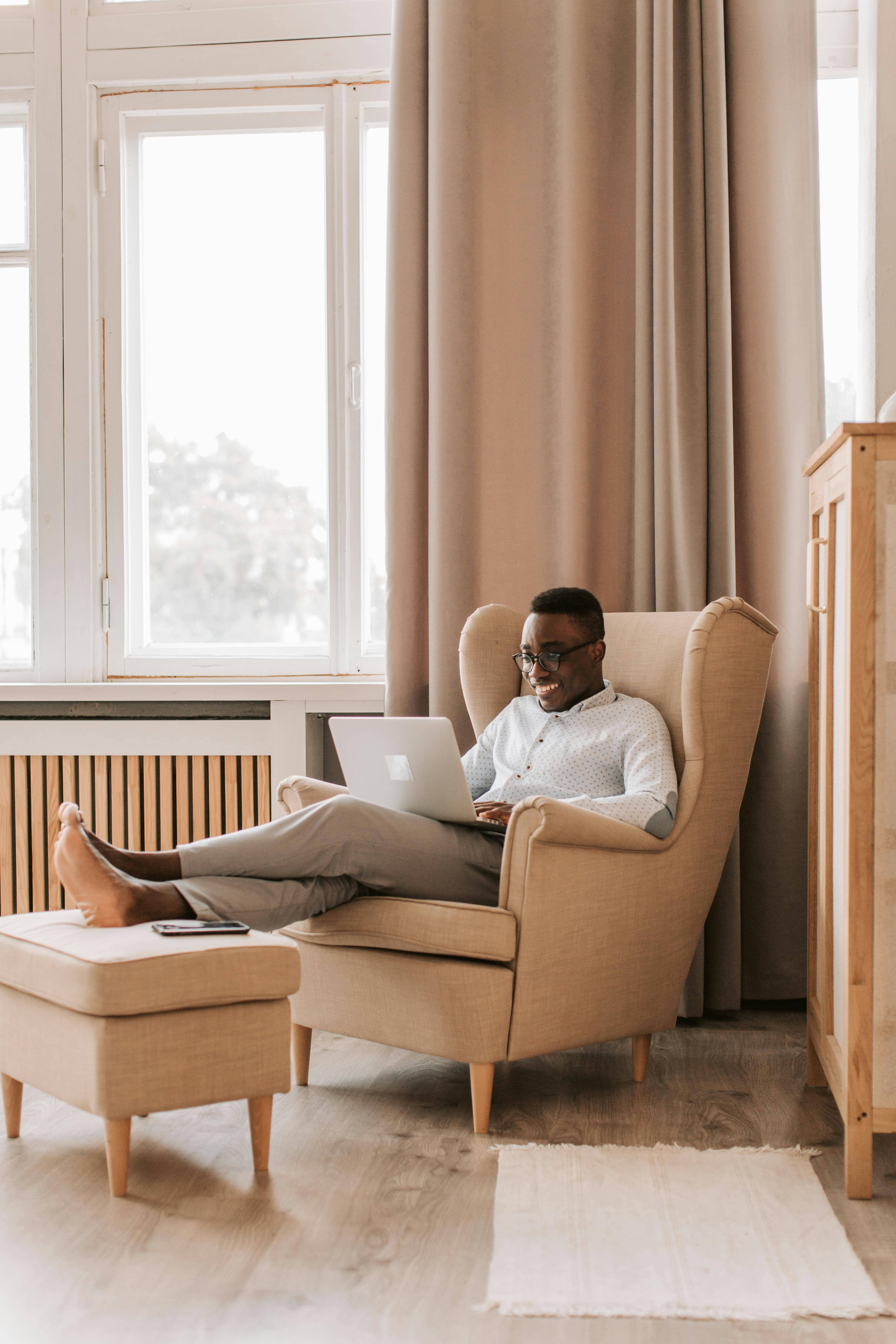 Man sitting on chair on video call